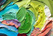 Close-up view of bright paint layered thickly. Strokes of paint