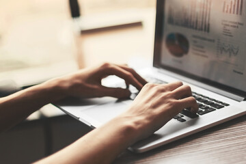 close up. business man using a laptop to analyze financial data.