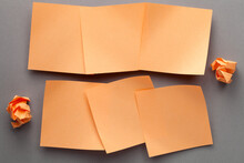 Orange Blank Paper Notes And Crumbled Paper