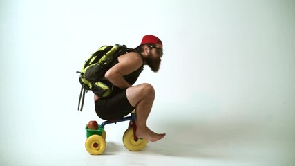 crazy tourist, happy bicycle rider. a funny bearded man is riding a childrens bicycle. delivery serv