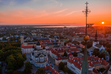 Wall Mural - Amazing aerial drone shot of old town of Tallinn, Estonia at sunset