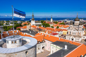 Wall Mural - estonian flag on tall hermann tower in the old town of tallinn, estonia