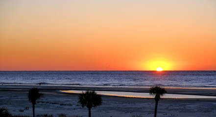 Wall Mural - Early Morning Sun Over Empty Beach