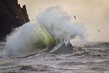 Stormy And Powerful Waves Crash Against The Cliffs Of Cape Disappointment