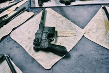 Close-up Of Gun On Concrete Floor