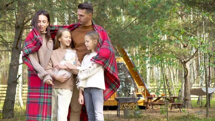 Wall Mural - Beautiful family walking at autumn warm day