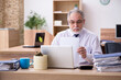 © Elnur - Old male employee working in the office