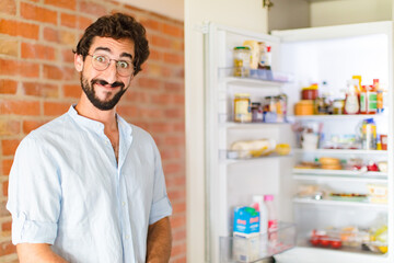 Sticker - bearded man looking happy and pleasantly surprised, excited with a fascinated and shocked expression