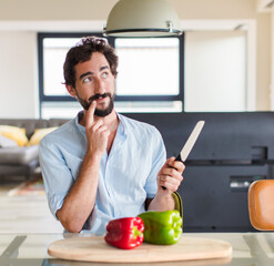 Wall Mural - bearded man smiling happily and daydreaming or doubting, looking to the side