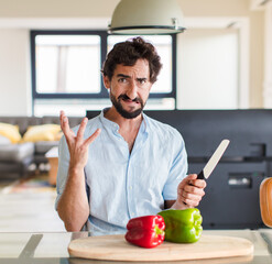 Wall Mural - bearded man screaming with hands up in the air, feeling furious, frustrated, stressed and upset