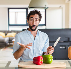 Wall Mural - bearded man feeling extremely shocked and surprised, anxious and panicking, with a stressed and horrified look