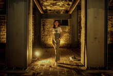 Woman Standing In Abandoned Building