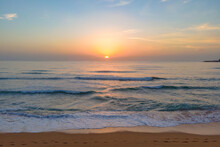 Soft Haze And Pastel Coloured Sunrise Seascape
