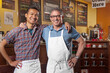 © SuperStock - Partners of cafe standing together