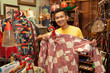 © SuperStock - Malaysian man shopping in vintage store