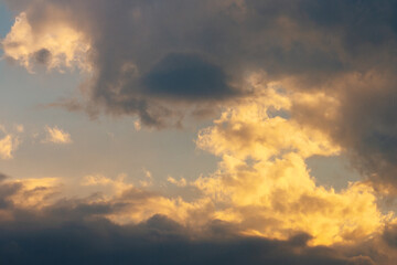 Wall Mural - glowing clouds on evening sky. beautiful nature background