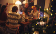 © Jacob Lund - Family enjoying Christmas dinner with drinks