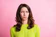 Photo of disgusted anxious girl grimace look side empty space wear green pullover isolated pink color background