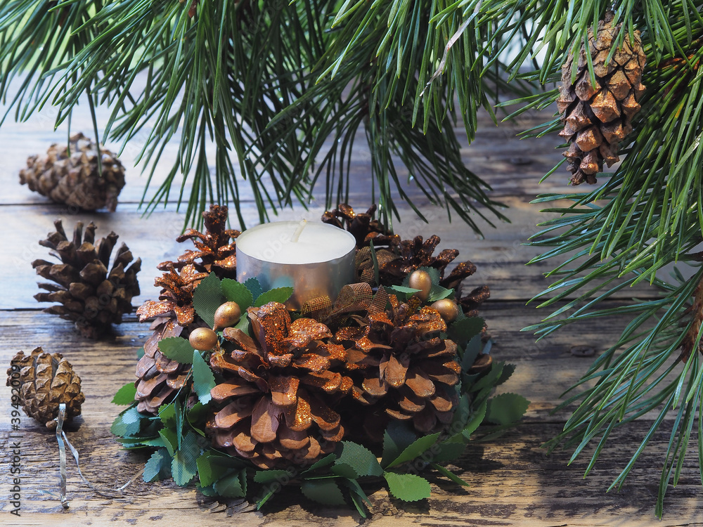 Christmas composition with pine cones and branches, candle holder with ...