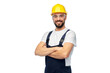 © Syda Productions - profession, construction and building - male worker or builder in yellow helmet and goggles with crossed arms over white background