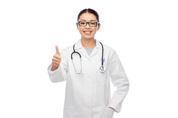 medicine, profession and healthcare concept - happy smiling asian female doctor in white coat and glasses showing thumbs up