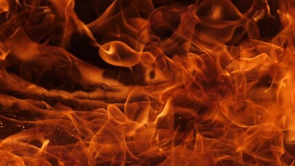 Wall Mural - slow motion speed close up scene of moving burning pattern as background. hot as inferno flame conce