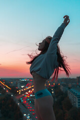 
girl in panties dancing on the roof