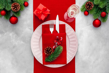 Christmas table setting with fir tree and bottle with glasses .on gray stone