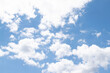 © Lina - Sky Background. Blue Sunny Sky Covered with White Clouds