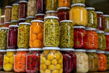 Various Preserved Pickled Vegetables In Glass Jars. Marinated Food And Organic Raw Vegetables, Canned Homemade Food Concept. Preservation And Storage Of Vegetarian Food For The Winter 