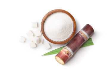 Flat lay (top view) of White sugar in wooden bowl with fresh sugar cane on white background.