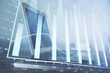 © peshkova - Forex graph hologram on table with computer background. Multi exposure. Concept of financial markets.