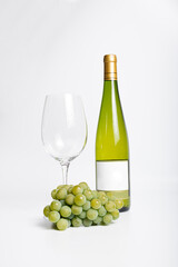 Wine bottle and two wine glasses. Wine bottle against a white background