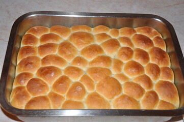 Homemade bread honeycomb shape. Bread on baking pan hot out of the oven.