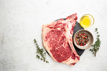 Wall Mural - Raw fresh meat T-bone beef Steak on white background, top view