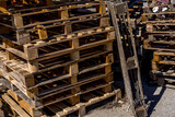 Fototapeta  - Many pallets stacked in stock, warehouse pallets. Old wood material. 