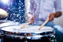 Indian Man Playing The Drums Sticks Close-up In Recording Studio