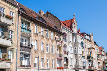 Old tenement houses on a background of blue sky