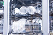 © aapsky - Dishwasher with a transparent door for monitoring the dishwashing.