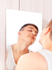 Canvas Print - Young Man near the Mirror