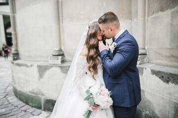 Romantic wedding moment, couple of newlyweds smiling portrait, bride and groom hugging