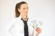 © Danko - Photo of pretty cheerful business woman standing isolated over white background holding money.