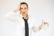 © Danko - Business caucasian woman holding alarm clock on a white background