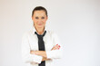 © Danko - Young business woman with arms crossed over isolated white background looking to the camera.