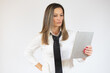 © Danko - Portrait of business woman holding tablet on white background