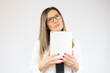 © Danko - Business caucasian woman holding tablet thinking on a white background