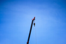 Automobile Crane On A Clear Blue Sky