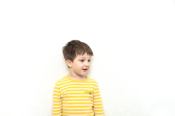 Happy Cute toddler boy caucasian in striped shirt with funny expression.