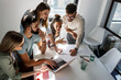 © BalanceFormCreative - Group of programmers an designers in conference room.They discussing about development of new project.