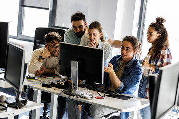 group of designers programmers working on a new project at the office.